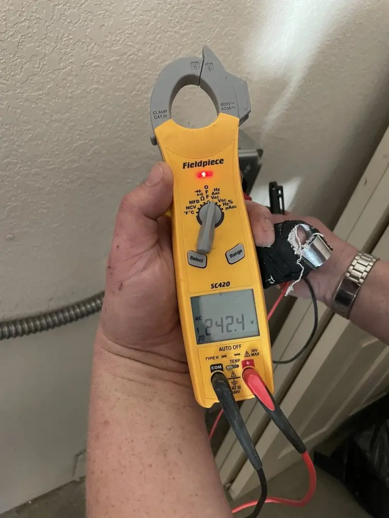 Voltage testing with clamp meter during Whole House Surge Protector in Magnolia